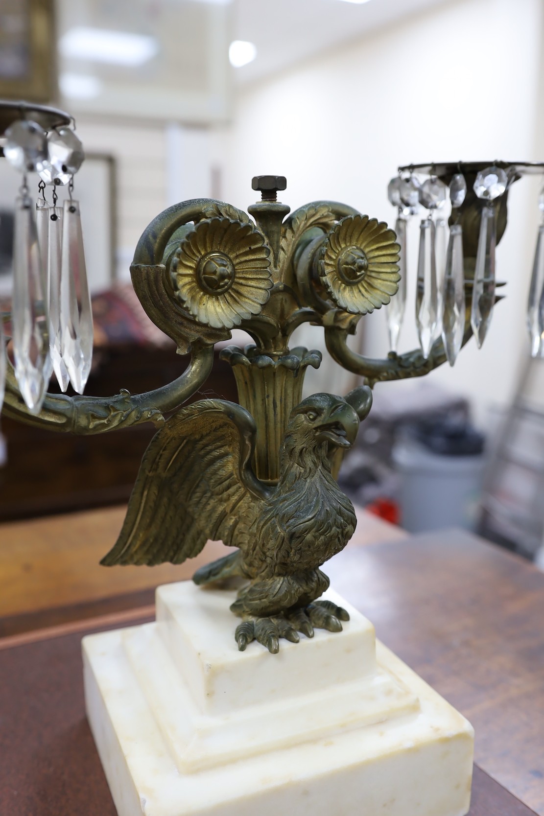 A pair of 19th century eagle two branch candelabra, 34cms high x 3cms wide